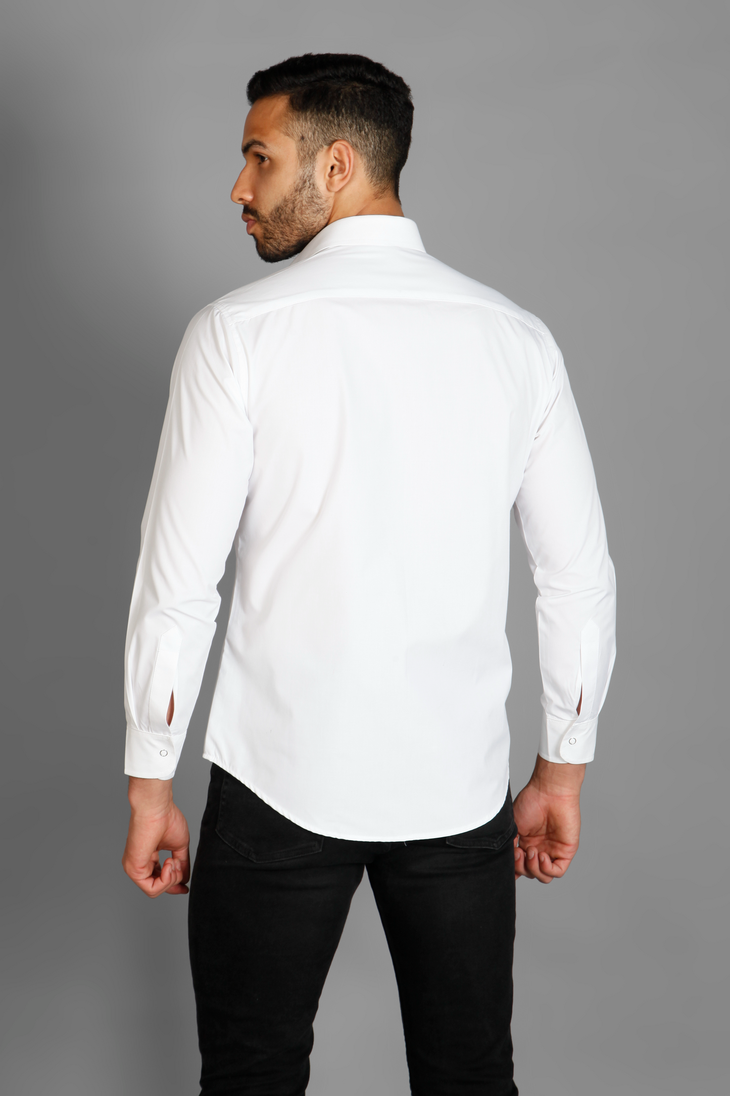 A white crisp cotton men's shirt with abstract big sea horse print detailed with metallic silver highlights on the print. The shirt is handcrafted for a regular fit style. Shop statement looks at Just Billi.