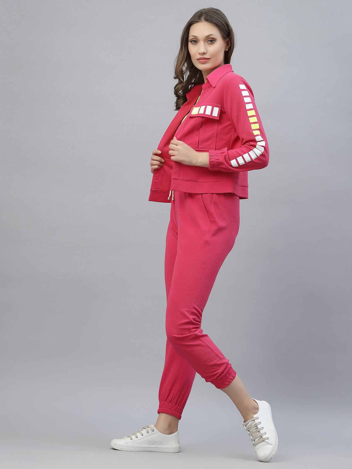 Bright coloured designer tracksuit, luxury airport loo, athleisure wear by JUST ILLI