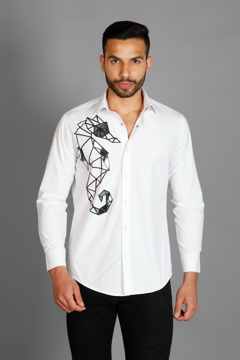 A white crisp cotton men's shirt with abstract big sea horse print detailed with metallic silver highlights on the print. The shirt is handcrafted for a regular fit style. Shop statement looks at Just Billi. 