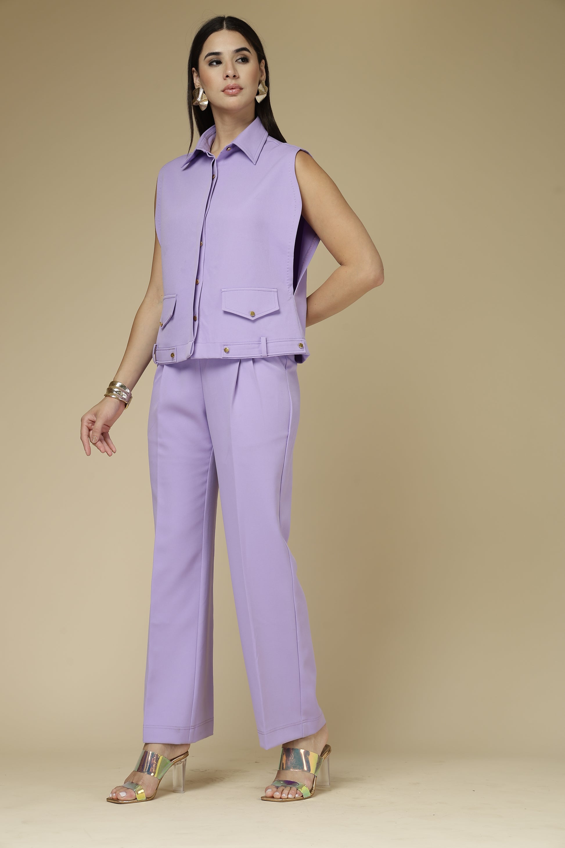Woman wearing a purple outfit against a beige background