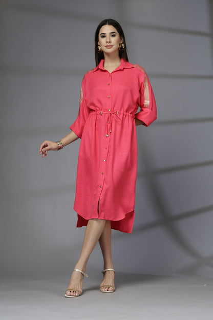 Woman wearing a red dress against a gray background