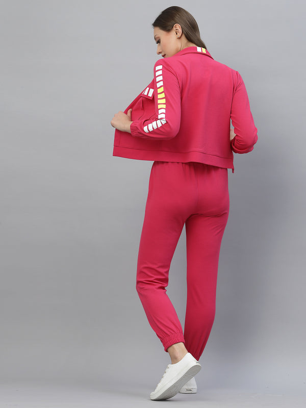 Bright coloured designer tracksuit, luxury airport loo, athleisure wear by JUST ILLI